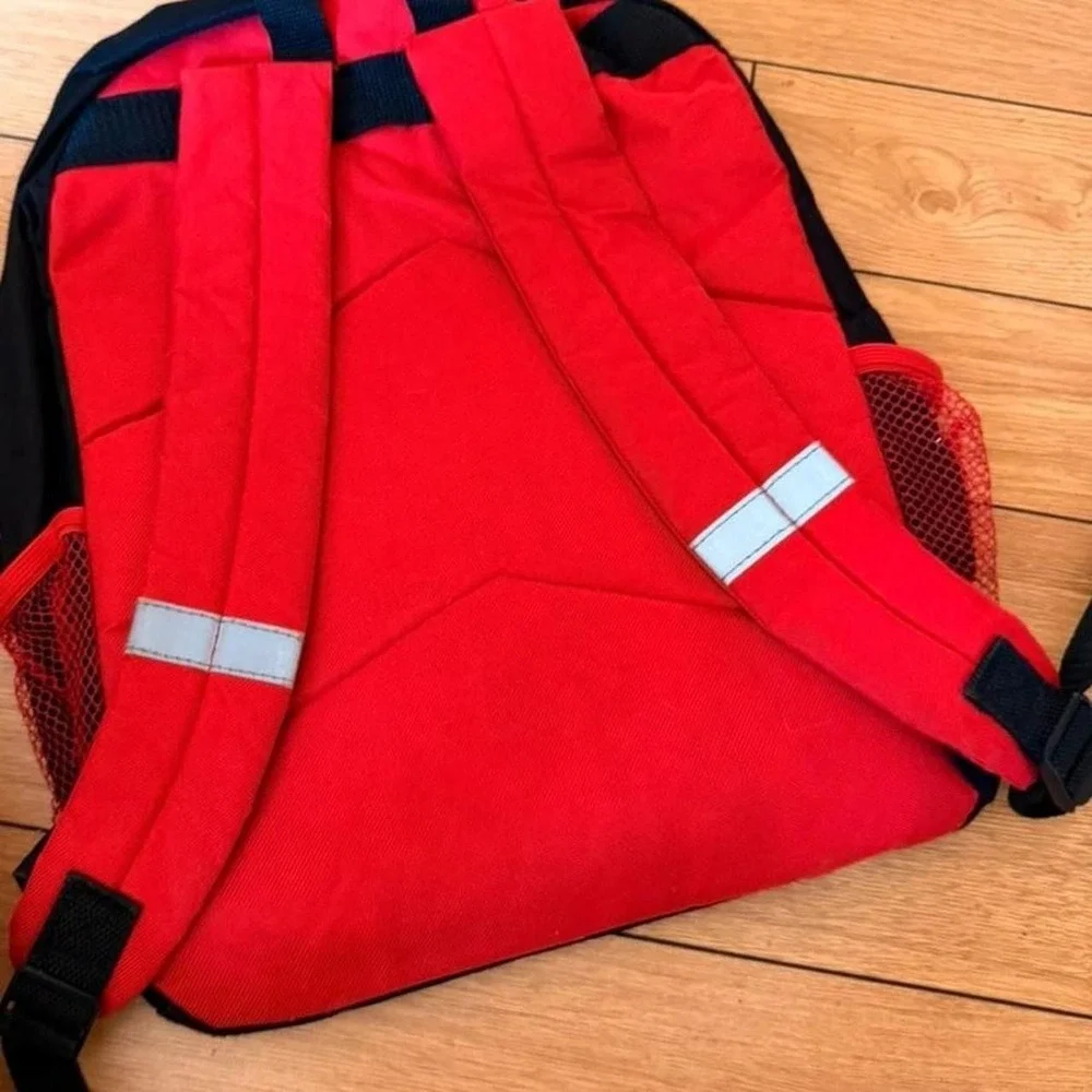 Nintendo Super Mario backpack with Mario and Luigi graphic on a brick background